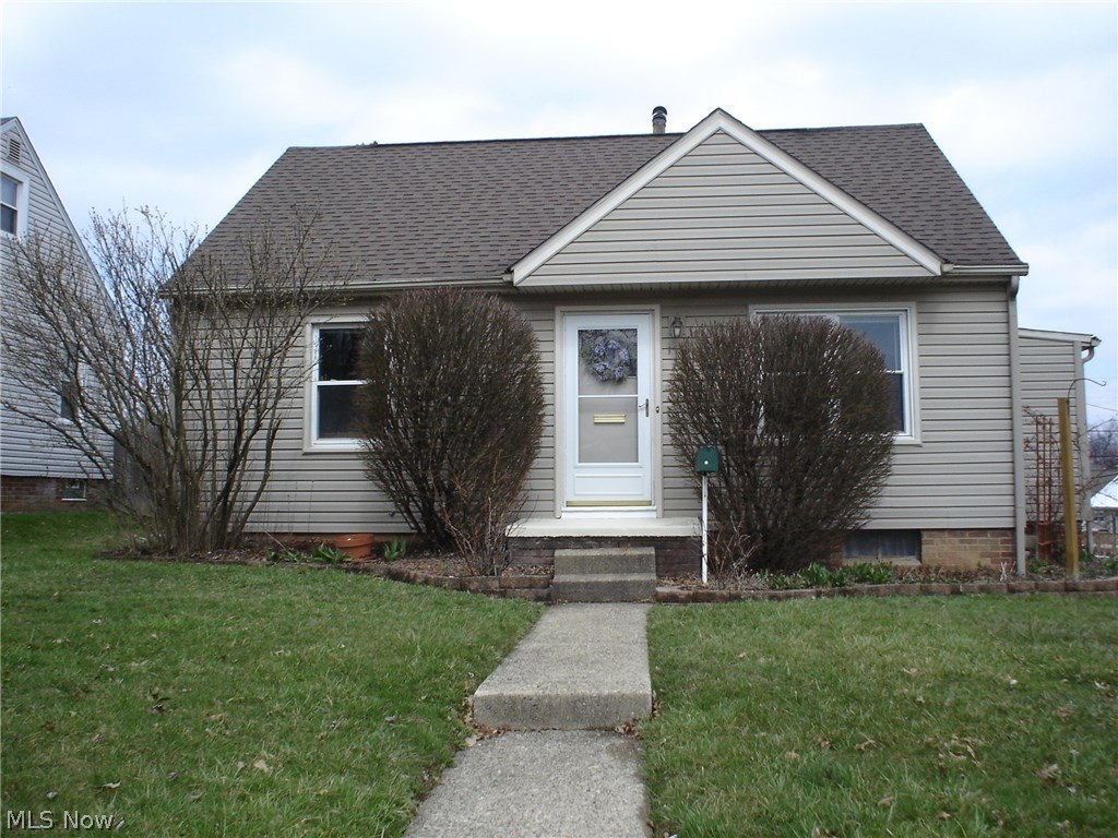 Fabulous bungalow with many updates throughout. 3 bedrooms with wood floors in many rooms, kitchen with newer floor and backsplash, mud room w/coat closet, newer vanity and updated flooring in bath, partially finished lower level, fresh paint in many rooms. Large deck, perfect for entertaining. Spacious yard, fully fenced with privacy fence on outer side. Detached garage with newer door and opener. Updates/improvements include: Most windows 2003, garage door and opener 2007, roof and siding 2004, side porch entry/mud w/closet 2002, kitchen flooring 2016, bath floor and vanity 2016, bathroom exhaust fan 2016, kitchen backsplash 2017, concrete pad for drive 2008, landscaping and retaining walls, fenced rear yard.
