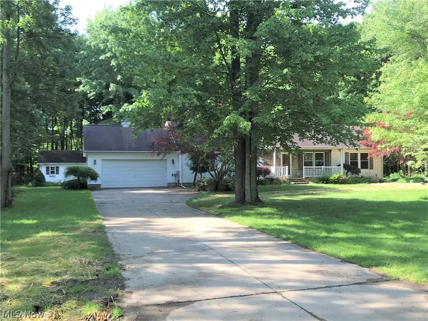 1,560 sq. ft ranch built in 2001.  3-bedroom, 2-full baths with split bedroom floor plan.  Newer paint and carpeting throughout.  Gas fireplace in the family room.  Kitchen w/ center island.  Open kitchen/dining/ family room with skylights for natural light. Master suite has full bath with walk in closet. Main floor laundry room. 2- car attached garage, concrete driveway. 4' concrete crawl space and walk up attic for extra storage. Located at the end of the allotment on an outside corner double lot totaling 1.75-acres.  Bordered to the south by acreage owned by Cleveland Museum of Natural History.  Private and serene back yard with garden pond, patio enclosure, multi level deck and large 20 x 16 utility shed.   This one will need a little elbow grease and personal touches but a great home for sure.  Additional lot available across the street to create a nice privacy buffer.  See MLS 4033839 for more information. New sump pump 2/21/2019, roof professionally repaired 2/22/2019.  Furnace