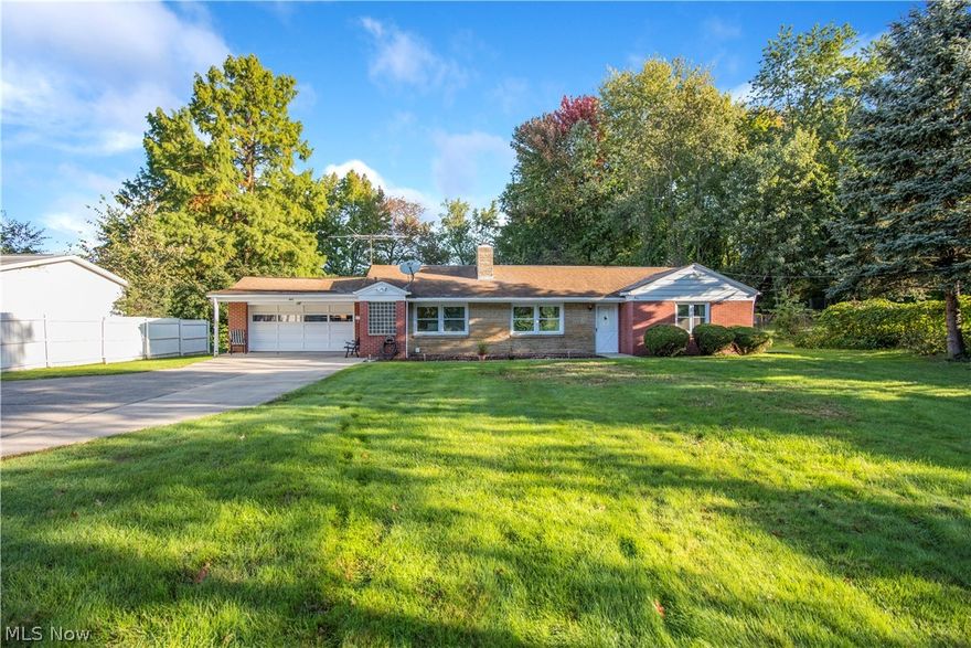 One floor ranch living on 3/4 acre! Nicely maintained, well cared for brick ranch with replacement windows, laminate flooring and many more updates! Concrete drive with extra apron, 2 car attached heated garage, 2 storage sheds and newer privacy fence with large open lot, right across the street from school and playground! Built in bookshelves, woodburning fireplace! Schedule your showing before it's gone!