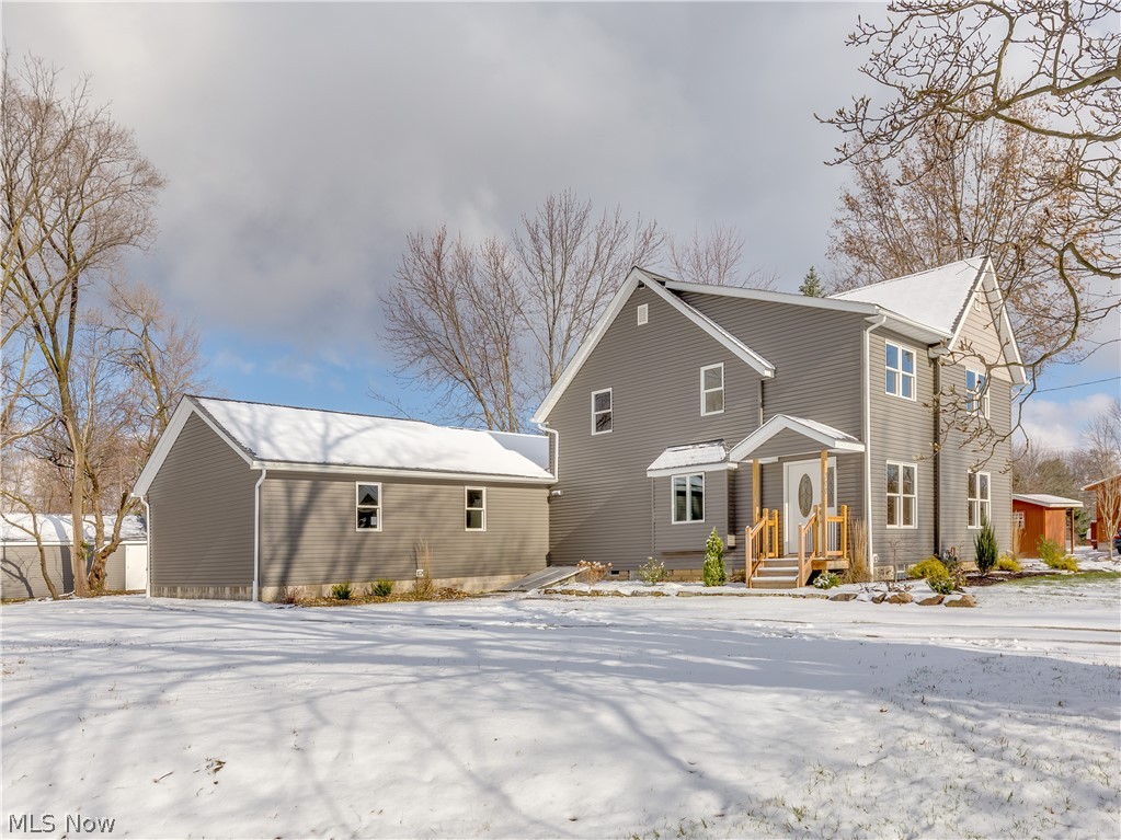 Spectacular find in the heart of Munroe Falls. This amazing farm house was originally built in 1903 but rebuilt in last 3 years from the studs in and transformed in to a stunning new home. With the help of an architect, the owner began the project anticipating that this would be his forever home. Things changed and the result is a home that has been finished in top-of-the-line throughout. Soft close Schrock cabinetry, granite counter tops, glass tiles and back splash, Train furnace and C/A, air cleaner, whole house filtration system, and luxury vinyl plank flooring are just some of the amenities. All wiring has been redone and updated to 200 Amp service and the house has been totally replumbed. A large Great Room with vaulted ceilings, fabulous kitchen with breakfast bar, a first and a second floor master suite, first floor laundry and half bath were all designed for enjoyable living. 3 full baths are a definite plus. Some of the old is still apparent in the sandstone that still r