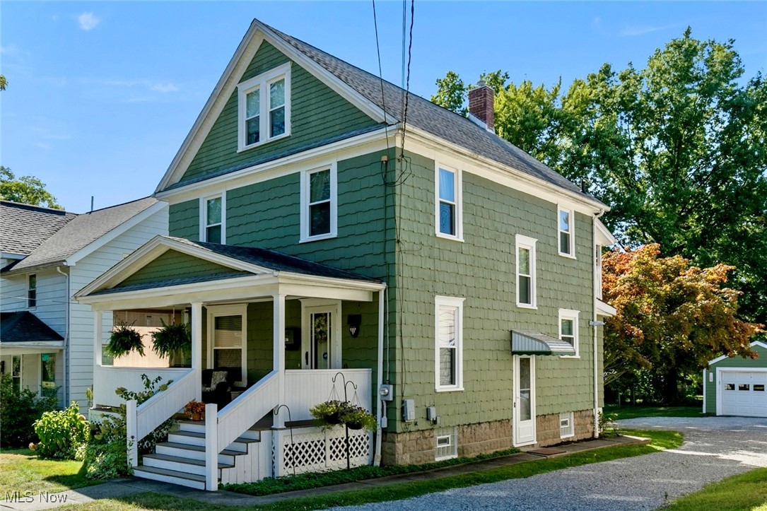 Step inside this classic 1930 two-story home with a finished third-floor attic offering bonus living space not included in the 1,528 square feet. Featuring 4 bedrooms and 1 bath, this home has been lovingly maintained by the same owner since 1976. Original hardwood floors rest beneath the carpet, with original doors and hardware preserved throughout. The main level includes a formal dining room, spacious living room, and a versatile bonus room off the dining area that could serve as an office, study, library, or den. The kitchen includes all appliances, which will remain with the home. Recent updates include a new furnace (2020), oversized one-car detached garage with new door and opener (2020), fully renovated front porch (2019), and freshly painted wood shaker siding. The dry basement features glass block windows and has been fully painted, offering storage and utility space. All windows were replaced in 2011. Located near downtown Ravenna, grocery stores, a movie theater, UH Portage Hospital, the Portage Bike and Hike Trail, and major interstates, this property provides both character and convenience.