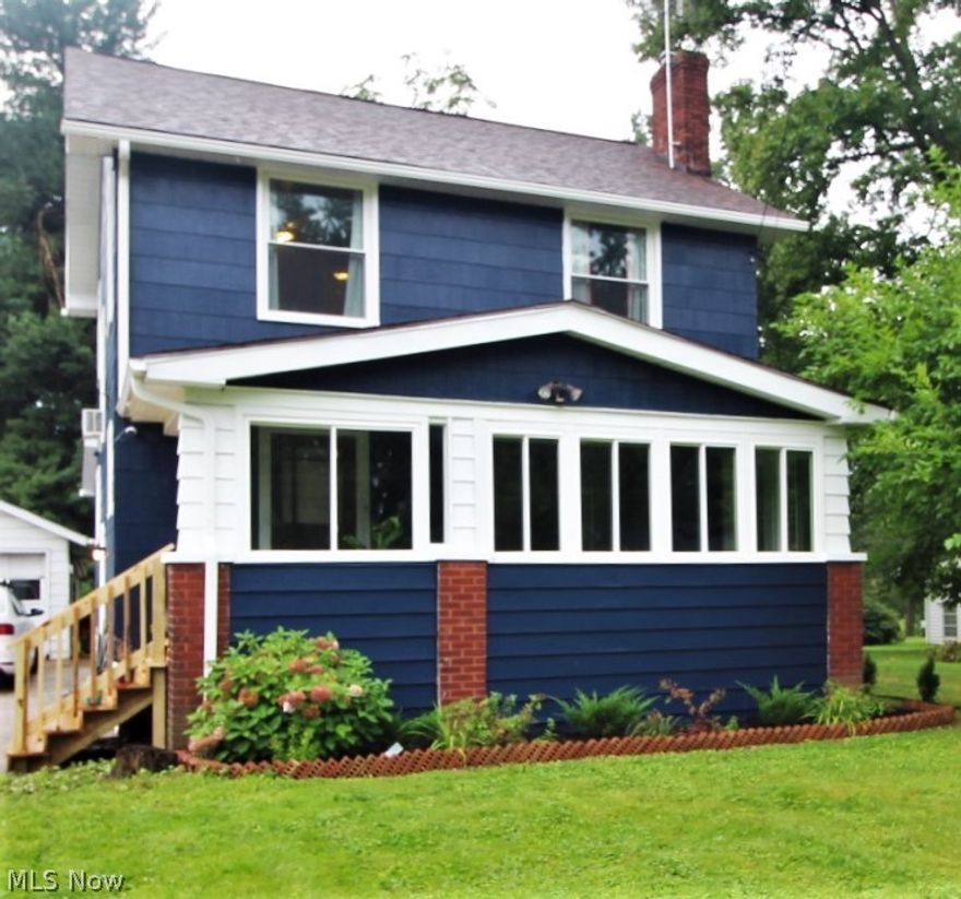 This Beautiful 4 Bedroom 2.5 Bath with 1,600 Square Feet, sits on almost half and acre with lots of Privacy!
So Many Updates Here!  You’ll Love the Large Open Kitchen with Newer Stainless Steel Appliances, Ceramic Flooring and Newer Windows Throughout! Lots of Character with Gorgeous Wood Moldings, Window Seat with Storage, Three Season Sunroom and Large First Floor Master Bedroom Addition with Ensuite! Enjoy sitting by the Woodburning Fireplace Looking out the Enormous Picture Window!  The Original Hardwood Floors are in Perfect Shape and all Upstairs Floor have Recently Been Refinished.  
Both Full Baths are Updated and Partially Finished Basement is Just Right for Watching Movies!  Other Updates include Newer Roof, New Gutters, Steps to Porch, Door, Freshly Painted, and 2020 AC/Furnace! The Basement has Been Waterproofed by Ohio State Waterproofing with a Transferable Lifetime Warranty!  Nothing to do here but move right in before the Holidays! This Absolutely Charming Home is Clo