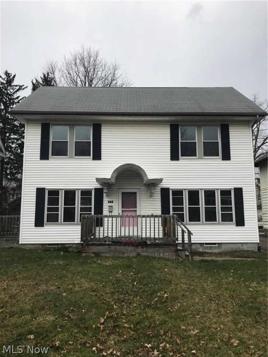 Don't miss this three bedroom colonial in West Akron! As you enter, you'll notice several of the home's original features, including ornate molding and detailed windows. Beautiful hardwoods throughout the first floor lead you into the clean and spacious kitchen, featuring newer cabinets and flooring. New refrigerator (2018), dishwasher, and range all provided. Sliding doors from the dining room lead you onto a private deck overlooking the large yard, and french doors off the living area make the private side deck a perfect area for relaxing. Make your way upstairs to three large bedrooms, all featuring fresh paint and carpet. Walk up to the bright, finished attic, a perfect spot for an office, playroom, or extra storage space! This home also features a private driveway with off street parking, and a one car detached garage. Both the central air and hot water tank have been recently updated, washer/dryer hook-ups provided in the basement. Within walking distance of two parks, and conven