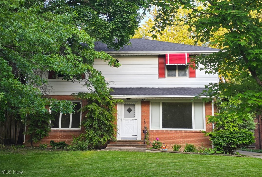 Plenty of curb appeal in this younger, University Heights Colonial on prime street!! Oversized Living room and Dining room off center hall. Spacious eat-in Kitchen with light wood cabinets and double oven has room for full dinette. Family room with built-in cabinets has sliding doors to patio and private back yard! Convenient first floor Laundry and half bath. Four large bedrooms up with en-suite full bath in Master, and full bath in hall. Much hardwood throughout. Rec room has wet bar for entertaining and gatherings! Two car detached garage. Add your personal touches! Conveniently located to Fairmount Circle and Cedar Center Shopping areas!