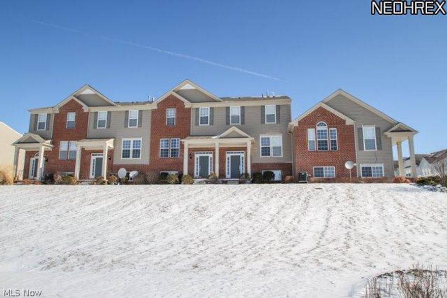 Stunning three-level, limited maintenance Montrose Park townhome with 2 master beds, 2.5 ba. Shows like a model: immaculate, neutral & move in ready! Grand, two-story hardwood foyer opens to a spacious & modern open-concept dining/living rm w 3 way gas fireplace. Large eat-in kitchen features gleaming hdwd floors, premium cherry cabs, corian counters, center island, upgraded SS Whirlpool appl, pantry, and access to balcony deck- perfect for al fresco dining with friends! First floor hardwood .5 ba & laundry w built-in shelving. Upstairs, are 2 oversized master suites with WICs & full en-suite baths. Owner's suite includes full bath w comfort-height dual-sink corian vanity, 5' walk-in shower and substantial WIC w custom california-closet-type built-ins. Finished lower level- perfect for home theatre, office or playroom- also has storage & mudroom from attached 2.3 car garage. Just minutes from I-77, I-271, grocery, gas station, banking, post office, shopping, dining, entertainment!