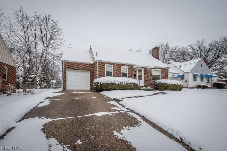 MOVE-IN READY BRICK BUNGALOW IN CONVENIENT LOCATION!  This home has so many charming features such as a living room with hardwood floor and wood burning fireplace, functional kitchen with dishwasher and dining room with arched doorway and hardwood floor.  Two nicely sized bedrooms are on the main floor plus a full bath.  The 3rd bedroom is quite large and has built-in shelving.  There's a bonus room in the lower level that would make a great office or playroom plus a storage room and laundry area.  Outside has great curb appeal as well as a covered patio and fenced backyard, perfect for kids or pets.  Newer windows, refinished hardwood floors, and an upgraded electric panel are a real bonus and the seller is offering a 1 year home warranty for added peace of mind.  Affordably priced with easy highway access and Stadium Park amenities makes this a great home for the 1st time buyer or young family!