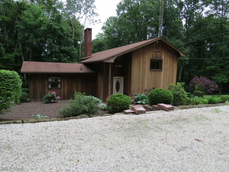 Secluded 8 room home on .66 acre private land Atwood Lake! Newly updated in the last 5 years, this property features 2 bedrooms, 2 bath, a walkout basement and 2 large patios plus a deck. The updated oak kitchen has plenty of storage and there are beautiful hardwood floors in many of the rooms. There is a stone fireplace in the living room with large windows overlooking wooded area and lake! 2 car detached garage plus a 15'x22' carpeted bar area leading out onto the second patio with wood burning fireplace and koi pond.  Perfect for year round or a weekend getaway! All appliances included. Too many amenities to mention! Mineral rights to transfer. Don't miss this one!     REDUCED!!  MOTIVATED SELLERS!!  PRICED BELOW APPRAISAL!!!  CALL AGENT TODAY!