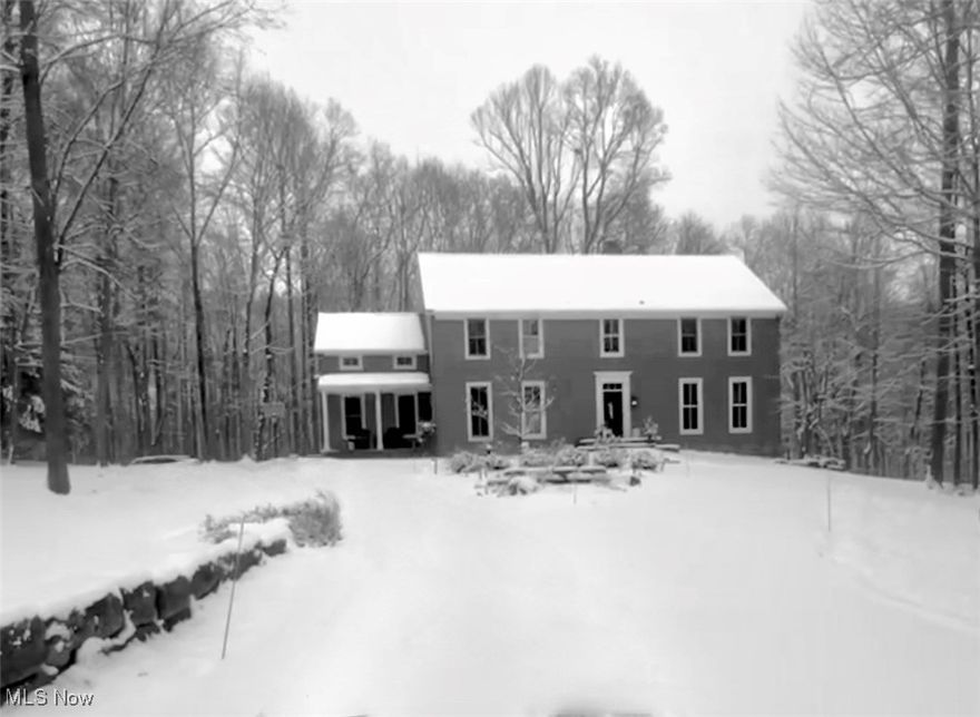 Welcome to your one-of-a-kind slice of paradise. Tucked a tenth of a mile into a tranquil wooded setting within a quiet neighborhood, this property offers a rare blend of seclusion and convenience. While you'll feel worlds away, the home is just a four-minute drive from Interstate 71 and a comfortable 22 minutes from the Cleveland Airport. Step inside to discover the warmth of Brazilian cherry hardwood floors that flow throughout the ground level. The living spaces are bathed in natural light, thanks to custom, expansive, two-story transom windows, ensuring you may find yourself forgetting to switch on the lights. Encompassing over four pristine acres, the property is a true haven. The grounds offer breathtakingly beautiful views and ample yard space, which includes a charming 1830s log cabin.
The main house features four generous bedrooms and four and a half luxurious bathrooms. The gourmet kitchen is a chef's delight, boasting elegant granite and stainless steel countertops, a vaulted ceiling, and abundant space for both cooking and dining.
The basement offers an additional 1000 square feet of finished living space with convenient walkout double doors. This area includes a closed room, perfect for use as an office, bedroom, or dedicated lounge area. A section of the basement is outfitted with durable rubber workout flooring, creating an ideal spot for a home exercise room. Every detail has been curated for comfort and sophistication. Additional custom amenities include a stone fireplace, a dedicated office space, a jetted tub, stone walls throughout the landscape, authentic street paving bricks and stone table on the patio. Let's not for get the extra-spacious three-car garage.

This is more than a home; it’s a private estate designed for those seeking tranquil living without compromising accessibility.