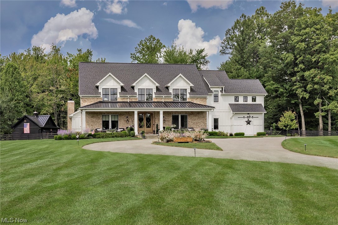 Luxury living at its absolute best, only 7 minutes from the center of Chagrin Falls! This stunning modern farmhouse style home was custom built by Alexandria Fine Homes on a private cul-de-sac street on an incredible 5 acre lot, surrounded by the 900 Acre West Woods and Western Reserve Conservancy. This 4 bed, 3 1/2 bath home has every upgrade imaginable. Exterior is a combination of Hardie Board and custom hand thrown brick. Walking through the mahogany front doors you notice that no detail was left out, from coffered ceilings in the living room, 3/4 white oak custom stained floors throughout, radiant heated stamped concrete floor in family room, 2 gas fireplaces, this marvelous home feels so welcoming. Gourmet kitchen includes custom cabinets, quartz countertops and back splash, 2 bosh dishwashers, farmhouse sink, Wolf range, Electrolux refrigerator and freezer, GE Monogram french door oven, microwave drawer and large center island with prep sink. Oversized laundry room has a built i