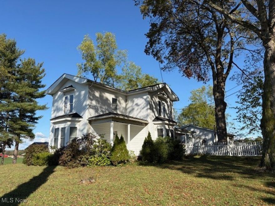 Check out this 3 bedroom 2.5 bath colonial located on 10 acres in the Marlington Local School District. Great location for this semi-rural property, yet close to highways, parks and more important the original New Baltimore Ice Cream stand. With 10 acres this one has many possibilities and has amazing country views from every side of the property. There is a large 32x24 detached garage with electric and concrete floor built in 2005. As you enter the home you will see a good sized eat-in kitchen with laundry area and half bath. There is also two family rooms and a first floor master bedroom with full bath. Upstairs offers two good sized bedrooms, full bath and an extra large landing at the top of the stairs. Some features include wood floors, solid 6 panel wood doors, updated vinyl windows and plenty of room to roam. Add your personal touches to make this one a great house to call HOME!