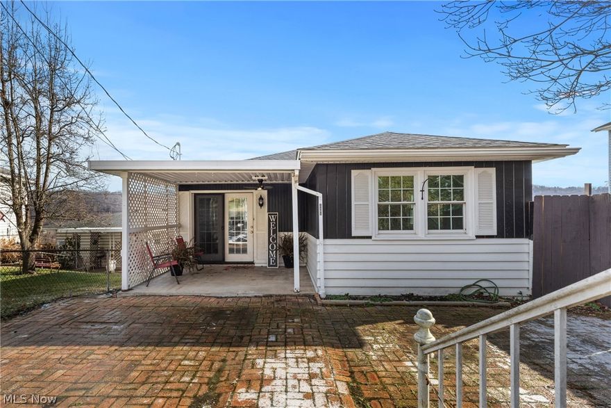 Welcome to this beautifully renovated home located in a nice, quiet neighborhood in Martins Ferry! 2 bedroom and full bath on the main floor with extra living space in the lower level for potential 3rd bedroom. Completely updated and truly move-in ready, this home features new LV flooring throughout the main floor and new carpet and ceiling tiles in the finished lower level. The updated kitchen offers new countertops, garbage disposal, faucets, and more, creating a fresh and functional space for everyday living. Enjoy all-new recessed lighting, new ceiling fans, newer double-pane windows, and fresh interior and exterior paint throughout the home. Major updates include a brand-new 200-amp electrical service with updated outlets throughout for added peace of mind. Outside, you’ll find a new privacy fence surrounding the front yard, attractive landscaping, a spacious front porch, and an inviting back porch perfect for relaxing or entertaining. The attached one-car garage, driveway, and additional storage shed provide plenty of convenience and storage space. All kitchen appliances, washer and dryer, plus an extra refrigerator and freezer in the laundry room convey with the sale—making this home truly turnkey!