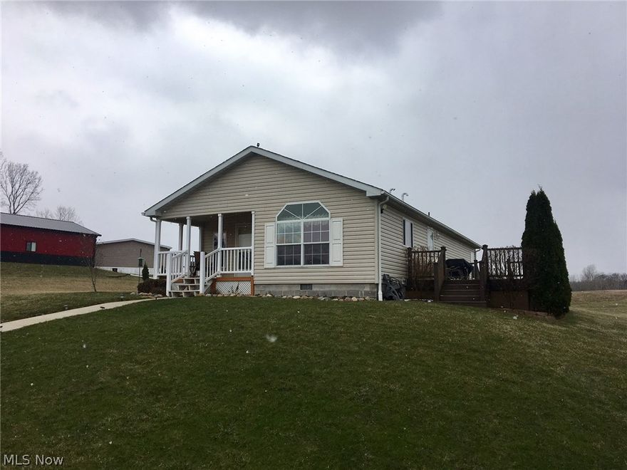 Great view from this 3 bedroom 2 bath home with a large detached garage on 2 acres.  The open floor plan will allow for entertainment all your family and friends.