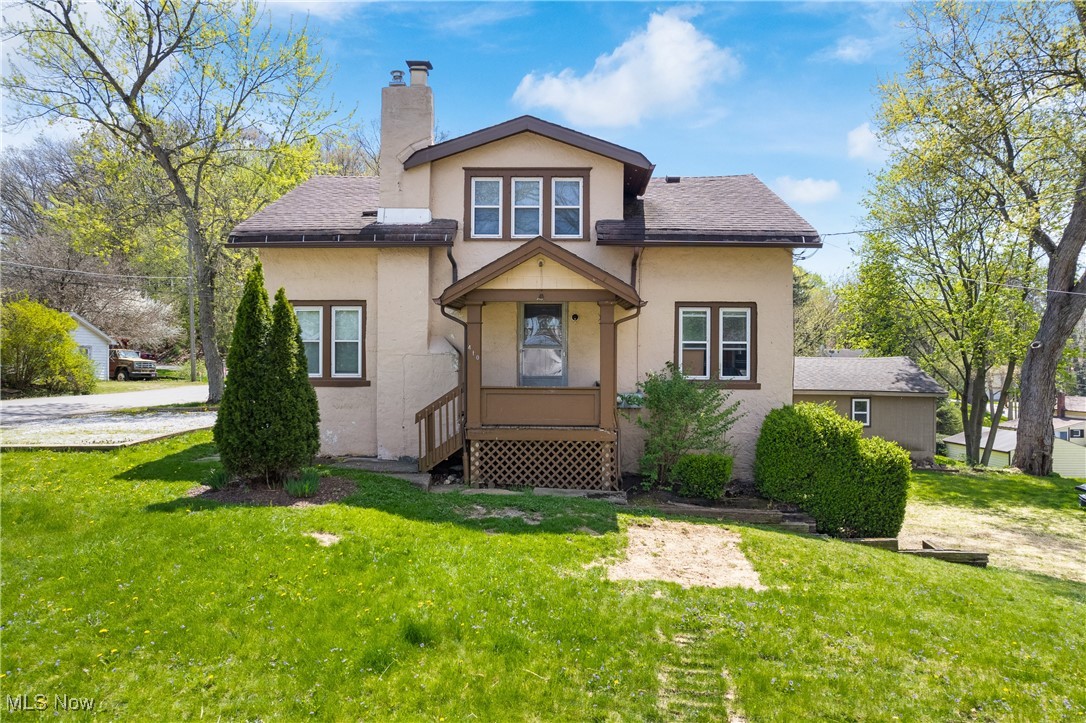 Here is a rare opportunity to own a multi-unit home in the Portage Lakes community with views of the water and many recent renovations! Featuring two separate units, each with its entrance and utilities, this duplex is ideal for investors or owner-occupants seeking rental income. The spacious 2 bedroom, 1 bathroom bottom unit has hardwood floors, a cozy fireplace, a generous living room, an oversized kitchen, and a breakfast nook! The bright and airy upstairs unit has 2 bedrooms, 1 bathroom, and an abundance of storage space. The basement provides a laundry area, extra storage space, and an additional bathroom! This home is also newly connected to public water for added convenience. Schedule your showing today!