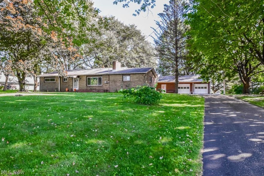 All brick 3 bedroom, 2 full bath ranch on over 4 acres with a pole building in Lake LSD! Back building can easily fit 3 cars plus room for a workshop. It has 2 garage doors with openers and a covered porch. The home itself needs work but has lots of potential. Hardwood floors in the living room, hallway and bedrooms as well as 2 woodburning fireplaces! The large, eat-in kitchen is applianced with a dishwasher, refrigerator, gas countertop range, wall oven and has a pantry. There’s a formal dining room with a bay window plus attic storage over the basement steps. The formal living room features a big picture window and a fireplace. Down the hall, there are 3 bedrooms and a full bath with tile floor and a tall vanity. Tons of storage throughout! The walkout lower level has a finished rec room with a fireplace, a full bath, glass block windows, a workshop with walkout access and laundry hookup - washer and dryer convey! Brand new furnace in May 2020 and hot water tank in October 2019. Won