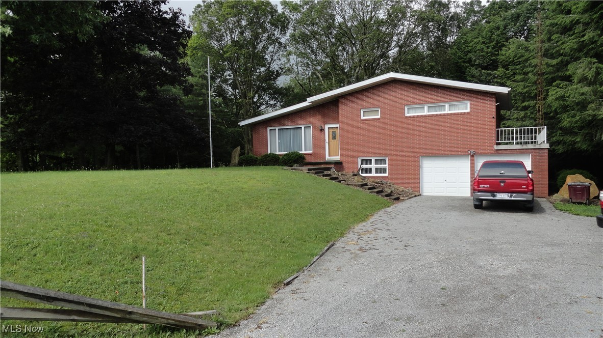 One owner brick tri level with basement. Beautiful country living, with over 7 acres, barn, pond, and flat yard. Nice park-like setting with stone patio for picnic table, mature trees, and nice yard. Once inside, you will love the 3 bedrooms, large eat-in kitchen, 4 seasons room off kitchen and overlooking the in-ground pool. On the lower level you will find a family room with stone fireplace, library, and door to pool patio. In the basement, there is a full bath, large laundry room, and large workshop. Much of the antique furniture and decor is available to purchase as well. Don't miss out on this oasis located between New Cumberland and Chester. Close to state park, casino, and convenient to Pittsburgh Airport.