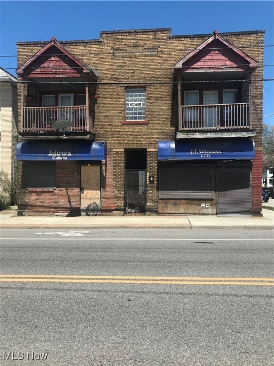 Brick, mixed-use commercial building for sale! This potential-filled property features two 2-bedroom suites, two storefronts, and a 2200 sq foot basement. There are many opportunities to start your real estate portfolio or become a commercial/residential landlord. Pictures are before clean out.