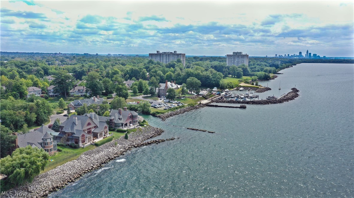 EXQUISITE PERFECTION! Impeccable waterfront home that offers every luxury and upgrade imaginable. Nothing short of a masterpiece and offers unparalleled quality. Walls of glass capturing the priceless water views from every room. Sleek and modern kitchen is outfitted with top-of-the-line appliances. Owners wing with a private balcony, a glamour bathroom, and a walk-in closet that does not disappoint! 2nd floor offers 2 additional bedrooms plus an in-law suite with full kitchen and private entrance. 3rd floor guest suite plus an office overlooking the water. The entertainment never ends in the walk-out lower level… billiards, poker, theatre, full bar, wine cellar, exercise room, full bathroom, and more! You do not want to let this one get away! Every inch of this home is meticulous with designer details throughout. Premier private gated community.