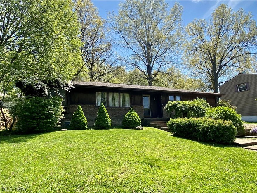 Prepare to be wowed by this spacious 4 bedroom, 3 bath ranch located in a popular Niles neighborhood close to Stevens Park. At nearly 2,000 square feet, this house has space to spare. But it also has a warmth and coziness that makes you want to sit and stay awhile. Main level highlights include an updated kitchen with plenty of cupboard space, center island, walk-in pantry, stainless steel appliances and breakfast bar. Just off of the kitchen is a large dining space featuring beautiful wood beams and a brick fireplace. The family room is bathed in natural light and overlooks the fenced backyard. The owner's suite (currently used as a playroom) offers dual closets and a private 3-piece bath. On the opposite side of the home there are three additional bedrooms, one with an attached bath, and a large guest bath. Other highlights include beautiful wide plank hard wood floors, first floor laundry room, full basement, and attached garage. Don't miss out on this house. It is larger than it lo