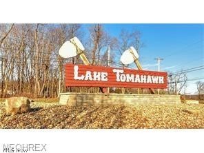 LOCATION, LOCATION, LOCATION... Build your dream home on these two lots. The dock is already in place for your boating enjoyment. Perk test has been completed and the Site Evaluation approved by the County. Lake Tomahawk, Columbiana County's best-kept secret, is a golf cart community with over 630 acres of land, 150 acres of spring-fed lake and just under 10 miles of roadway. Marina with a convenience store, fuel, and public boat access. Beach area for swimming, pavilion, volleyball, shuffle board, playground and many picnic areas throughout.