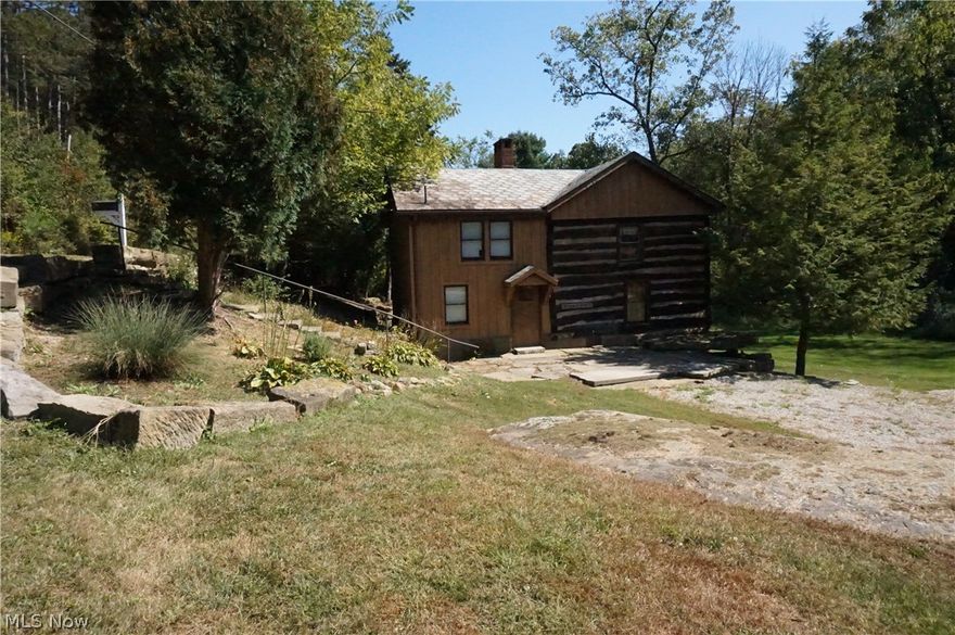 Charming cabin with 2 acres near Glenmont.  The dwelling offers 1,536 sq ft, 2 bedrooms, 1.5 baths, eat-in kitchen, and living room.  Part of this small home is a very nicely restored 1800s cabin.  The property also features a 26 x 24 detached garage and two sheds.  The stone patio and rustic barn stone add a lot of character to the setting.