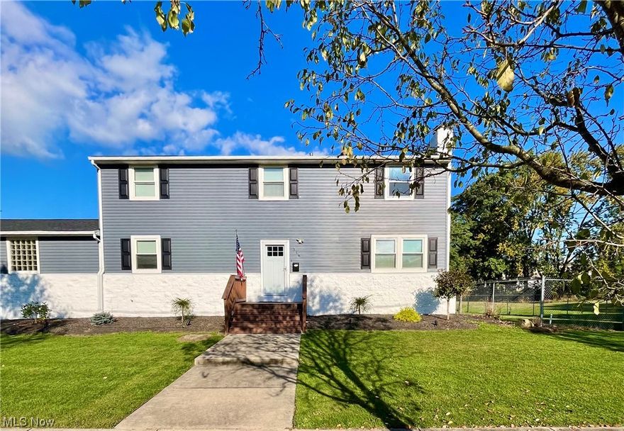 Start the new year off in this fantastic home. Great location, close to Highland Square, Fairlawn shopping, and 77. This home will be great for family gatherings and parties! Large attached garage is 35'x23' with 12 foot ceiling. Driveway is very large to provide more than enough parking for large gatherings. Large kitchen, with new vinyl flooring and countertops (2023), can certainly handle more than one cook. Sliding door leads to beautiful new  (2023) composite deck for outdoors entertainment right off of kitchen. Inviting living room, with gas fireplace and cathedral ceiling, is full of natural light with 2 levels of windows. Dining room is conveniently located off of kitchen and living room. Full baths are located on first and second floor. 4 bedrooms include 1 on first floor and 3 on the second. Basement is clean, dry, and freshly painted (2023). Basement is also plumbed in for another bathroom if you wanted to add a 3rd, and offers plenty of open area to finish if additional living space is desired. This beautiful home surprisingly good sized lot for the area, leaving plenty of room on either side between neighbors. Large back yard is fenced in and houses a large shed. Recent updates include : complete interior painting (Dec 2023), all new carpet and vinyl flooring throughout entire home (Dec 2023), rear deck (2023), front exterior and storm doors (2022),electric panel (2022), 2 new furnaces (2022) vinyl siding (2022), kitchen counters and backsplash (2023), and more.