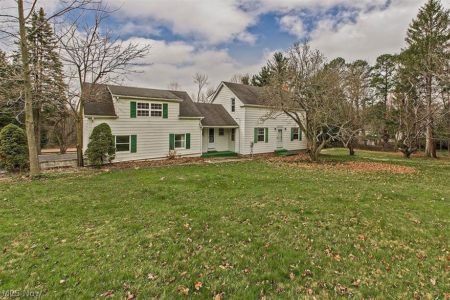 Lovely farmhouse beautifully situated on nearly two acres! This colonial offers all the charm of a century home with numerous updates and improvements bringing it up to today's standards. The living room is light filled with a beautiful fireplace and adjacent dining room. The kitchen showcases stainless steel appliances, cherry cabinetry, and a breakfast bar. Rounding out the first floor is space for an office or play room. On the second floor, a master bedroom has an ensuite bathroom featuring a vanity with double sinks, as well as a walk-in shower and separate glamour tub surrounded with a lovely tile. Three more bedrooms with great character, a hall bathroom, and a finished attic/storage room can also be found on the second level. The walkout lower level offers a recreation room with wood built-ins and a laundry room. Outside, a beautiful yard spans back to picturesque meadows and a floating deck that overlooks the lush scenery. Close to shopping, the highway, and top-rated Solon sc