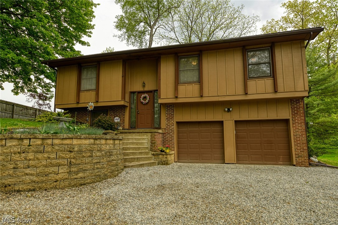 Great 3 bedroom home, tucked back on a private 1.12 acre lot in the very desirable Lake school district! Surrounded by beautiful mature trees. Backyard provides a cleared area and a gorgeous deck off the dining room. Entry way provides updated laminate flooring, leading up to the main level. The open floor plan connects the living room, dining room and kitchen. Living room provides a great view into the wooded front yard. Dining room features gorgeous mahogany look laminate flooring. Kitchen offers an island with breakfast bar, newer stainless steel appliances, including a 5 burner range! The tile look laminate, runs through the kitchen and down the hallway leading to the bedrooms. Master bedroom features an en suite, ceiling fan and large closet! You will also find 2 additional bedrooms, each with ceiling fans and another full bath on main level. Downstairs you will find the family room with a working gas fireplace! On the lower level, is the unfinished portion of the basement, with w