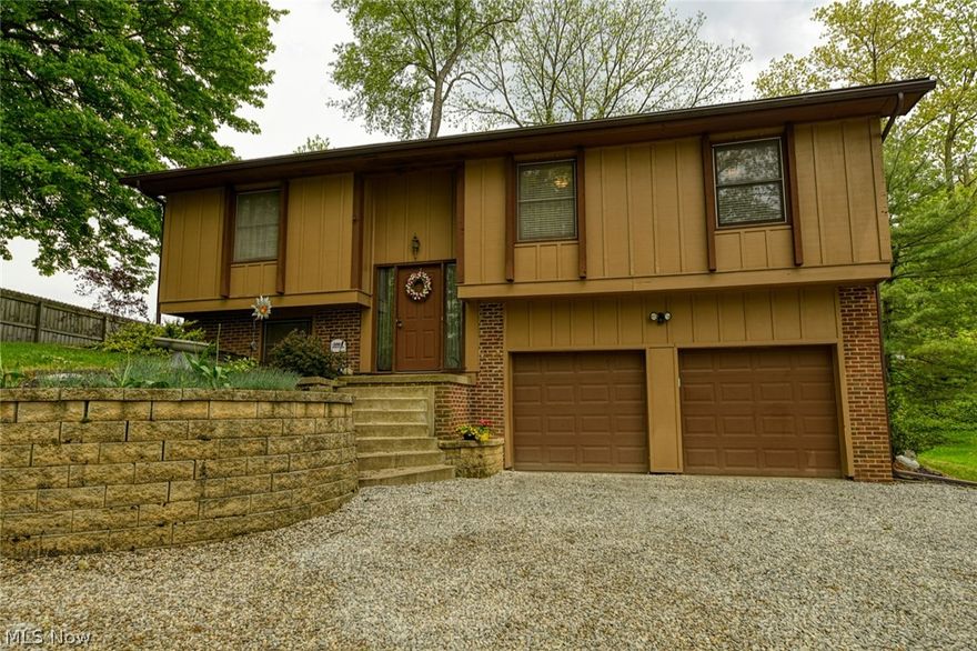 Great 3 bedroom home, tucked back on a private 1.12 acre lot in the very desirable Lake school district! Surrounded by beautiful mature trees. Backyard provides a cleared area and a gorgeous deck off the dining room. Entry way provides updated laminate flooring, leading up to the main level. The open floor plan connects the living room, dining room and kitchen. Living room provides a great view into the wooded front yard. Dining room features gorgeous mahogany look laminate flooring. Kitchen offers an island with breakfast bar, newer stainless steel appliances, including a 5 burner range! The tile look laminate, runs through the kitchen and down the hallway leading to the bedrooms. Master bedroom features an en suite, ceiling fan and large closet! You will also find 2 additional bedrooms, each with ceiling fans and another full bath on main level. Downstairs you will find the family room with a working gas fireplace! On the lower level, is the unfinished portion of the basement, with w