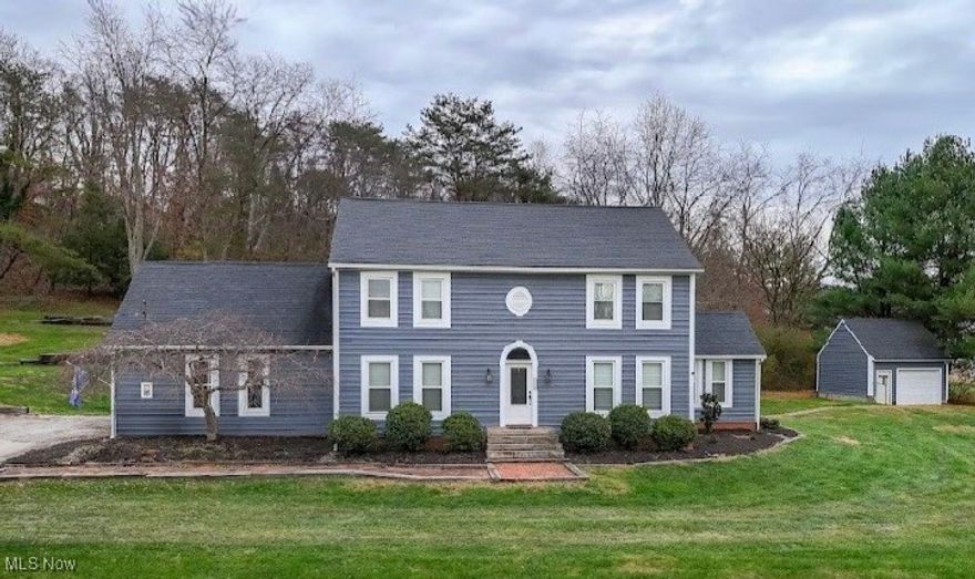 This stately home features a traditional layout and is situated on nearly an acre lot.  Front door opens to a two-story foyer.  Main floor boasts a living room, dining room, eat-in kitchen and a vaulted ceiling den off the dining room.  Also, there is an additional room currently being utilized as a bedroom.  It would make a great home office, just inside the front door.  Second floor features four bedrooms with a main hallway full bath.  Primary bedroom has a private bath with both a shower and a jetted tub.  Several rooms have new farmhouse style ceiling fans.  Two-stall attached garage has a bonus room over it, which could be used as additional living space or storage.  At the back of the property, there is an additional detached garage/storage building.  All this, plus the home boasts a brand-new professional hand-brushed painting and repair to exterior cedar siding, using premium paint and primer.  Interior has also been refreshed.  Imagine the memories you can create in your new home.