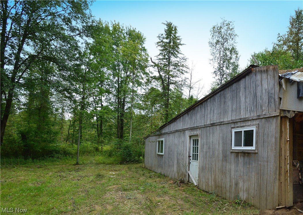 A lovely wooded lot of almost 15 Acres with a cabin in Jefferson. This lot is private and is close to Highway Access. The cabin is in need of some work and sold AS IS. The sellers have cleared a large area around the cabin and have added a new gravel driveway.