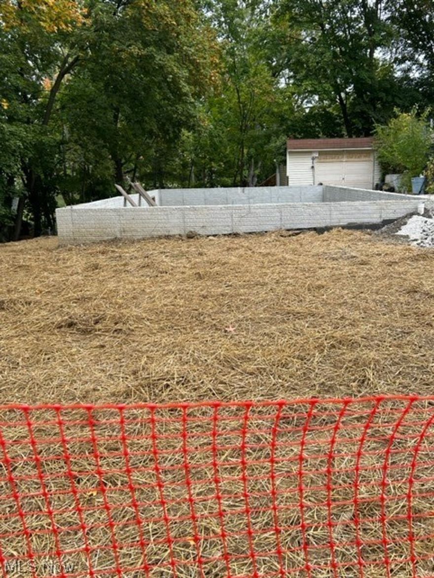 Great opportunity to finish a building in Medina City.  Approved permits for 2 bedroom ranch are transferable.  Plans to convey.  Foundation with egress window for possible third bedroom is in.  Many materials already purchased are included with sale.  Trusses, first floor package (not including studding), windows, steel beam and 3-post included.  Some items on site.   Some stored off site.  Buyer to confirm items prior to sale.  Existing detached garage.  Site work including fences, erosion control, drain tiles and excavating required by City.