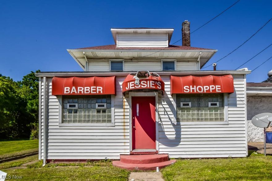 Prime investment or live/work opportunity! High-visibility commercial space with two separate entrances. Formerly a barber shop, this level is equipped for a salon business or can be tailored to your needs. Upstairs, discover a 2-bedroom, 1-bath apartment with an eat-in kitchen and private rooftop deck. Lower level boasts dual entrances, while upstairs has a private entrance. Separate metering and a fenced backyard complete this rare find. Schedule your tour now!