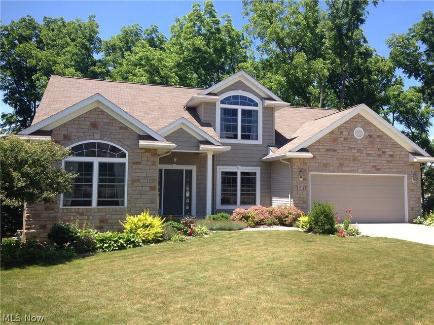 Like new Weaver built home with open floor plan.  You will love the color of the rich cabinets in the kitchen with center island, built in desk area and ceramic tile floor.  The 2 story great room boast stone fireplace and beautiful windows.  Formal dining area is open into great room.  Large 1st floor master with spacious bath including double sinks, jetted tub, and large walk in closet.  The first floor also features the 4th bedroom which the current owner uses for an office.  Upstairs you will find 2 spacious bedrooms and a large hall bath with double sinks.  The second floor balcony overlooks the great room.  The walk out lower level is plumbed for a full bath and overlooks the gorgeous back yard.  This home is well kept and has neutral décor throughout.