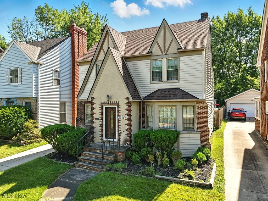Welcome to your dream home in the heart of Cleveland Heights! This beautifully maintained shipshape and feature-rich property invites you in with its warm atmosphere, offering an abundance of space and modern conveniences that are perfect especially for a big family life and entertaining friends. Imagine cozy evenings spent in one of the three spacious bedrooms on the second floor, with two additional bedrooms on the third floor, giving everyone their own special retreat. You'll appreciate the comfort of two full bathrooms and a half bathroom that ensure no morning rush at home. Picture yourself sipping coffee in the versatile bonus room on the second floor-it's perfect for a home office, playroom, or a cozy reading nook, with access to a lovely integrated porch. The eat-in kitchen is where your culinary dreams can come to life, boasting gorgeous granite countertops and stainless steel appliances. Whether you're having a casual dinner in the kitchen or hosting a formal meal in the dining room, there's plenty of space for laughter and connection. Unwind in the comfortable living room or step through the French doors into your four-seasons sunroom, a peaceful sanctuary that you'll adore year-round. Downstairs, the fully finished basement awaits, featuring a family room with an electric fireplace, an extra kitchen, a full bathroom, a storage room, a wet bar, and even a wine cellar—ideal for entertaining or hosting guests. Step outside to discover your spacious deck, perfect for summer BBQs under the electric awning and a nook just for the grill. The backyard, with its ample space for extra seating, is a great spot for gatherings, and the convenient shed offers extra storage. A two-car detached garage and a recently updated driveway add to the home’s charm and functionality. With a quick two-minute drive to Cain Park plus proximity to hospitals, museums, orchestras, shopping, and downtown, this home is a perfect place to enjoy the community and all it has to offer.