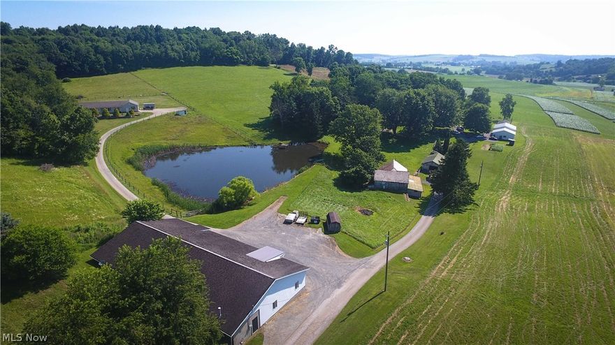Auction 8/13: Settled back a long lane is this established Amish homestead in Sugarcreek Township; this property offers everything one would need with home and multiple outbuildings. The home features an eat-in kitchen, dining room, living room, front room for office or sewing room, bedroom, and a full bath on the main floor. There are 3 additional bedrooms and a full bath upstairs. The basement is walkout with a canning kitchen, storage areas and laundry area. Utilities to the home are gas heaters, septic & a shared well. The home is wired and could easily be hooked up for a gas furnace. Additional outbuildings include a 30’x60’ shop fully insulated with heat & plumbing, newer dog kennel building with solar power & in-floor heat featuring 7 pens, 3 whelping boxes and 2 weaning pens, and a bank barn. The shop on Parcel 2 is a 50x100 commercial building with 2 loading docks, gas heat, electric & water. It’s fully insulated and has a restroom, office and large work area. Finishing off th