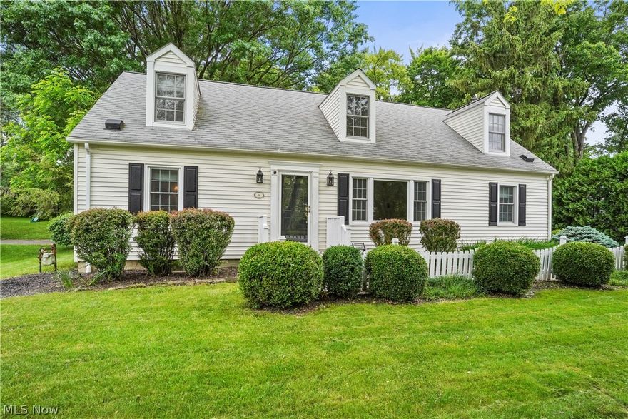 Location! Location! Location! in the heart of Hudson! Walking distance to downtown, shopping, stores, restaurants, grocery stores,  and nature trails. Enjoy walking to the Farmers market on Saturdays from June - October for fun and shopping. Spectacular, spacious and immaculate Cape Cod awaits you. Step into the large living room with gleaming hardwood floors and big windows, that directly lead you to the formal dining room with wainscoting and then to the kitchen, both with real hard wood flooring. Off the kitchen you will entertain or hang out in the spacious family room with French doors that lead to the paver patio. This wonderful cape has mostly all newer windows with custom Roman shades (3 bedrooms have black out shades), and 6 panel solid core doors, newer carpet in family room, bedrooms, and lower level ( 2022) All appliances including washer dryer convey with the home. The first level has 2 big bedrooms ( one is currently used as an office) and a full bath with tiled floors, linen closet, cultured marble countertops and walk in shower.  Upstairs (with solid hardwood steps) you will find 2 more big bedrooms, including the Master that is huge, with built- ins walk in closet,  a master bath. The second bedroom upstairs is also very roomy. Both have the charming old world nooks! The hallway upstairs has a lot of storage closets, there are a lot storage closets throughout the home! The lower level has a big finished area with built- ins, newer carpet , a full bath, a radon mitigation system, and storage area. The 2 car garage is steps from the entrance to home and is very deep with shelving. Wait! We're not done! There's a BONUS room above the garage. Fully finished for an office with skylights, heat and A/C  that can be used as a craft room, work out room play room etc. with celling fans and canned lighting. The back yard is large, private with mature trees, fenced, with a  big garden box ready for planting. Home Warranty included for the buyer.
