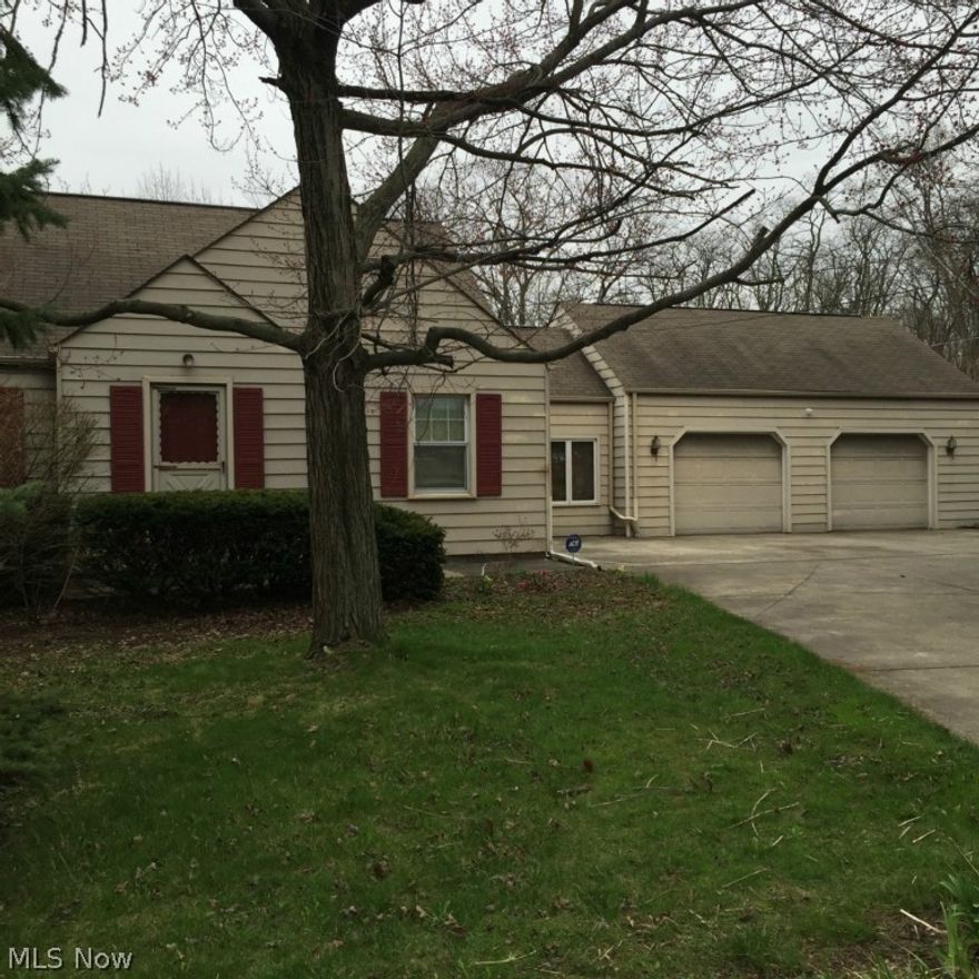 Enjoy your own private oasis in the heart of Austintown!  This immaculate 3-4 bedroom 2 bath home shows definite pride of ownership.  With a spacious eat-in kitchen, large living room and a beautifully finished rec room in the basement there is plenty of living area!   Enjoy your coffee on the large deck overlooking the secluded, fenced in backyard. There is a 2 1/2 car garage with a breezeway in the front and a carport in the back with an entrance off of Yorkshire.  The owner installed an electric gate to access the carport...or you can use it as a large covered patio.  Great for backyard BBQ's!  No work to do in this beautiful house.  Just move right in and make it your home!