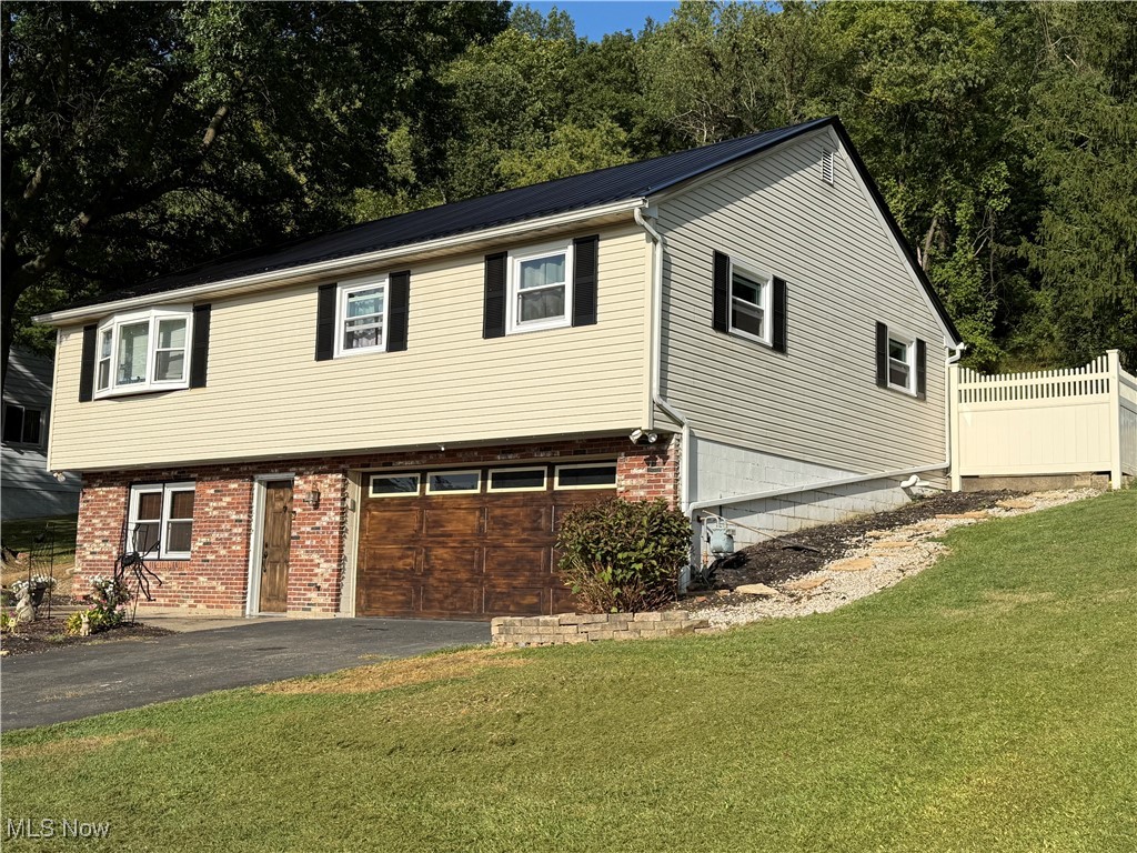 Welcome to 890 Green Drive! This beautiful 3 bedroom, 2.5 bath ranch home is in a desirable neighborhood and just down the road from Coshocton City Schools. This home offers a brand-new metal roof and windows (June 2025) and new flooring throughout. Once you enter, you'll notice a family/rec room perfect for family gatherings, and a spacious living room, dining room, and kitchen. The master bed/bath has access to the private outdoor patio, which offers ample space to grill, sit, and enjoy the peaceful scenery. All appliances will convey to the new owners. Don't miss the opportunity to make this your new home! Call today to schedule a showing!
