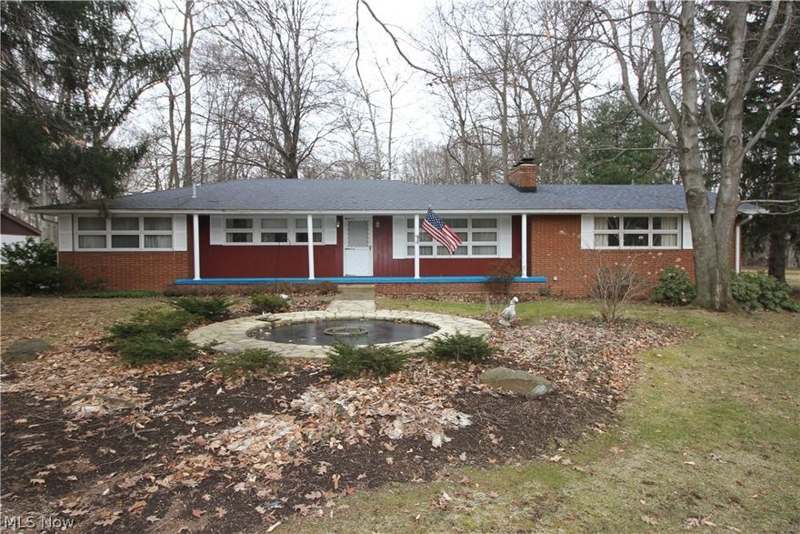 ONE OWNER brick ranch with 4 bay garage/shop area with heat/cooled office area (was used for a plumbing business).  Would be great for a plumber, hvac, lawn guy or electrician.  2 car attached garage to brick ranch.  Well maintained and just needs some updating/personal touches to make it your own.  Over a 1 acre wood lot with huge paved parking area out back for the kids to play ball or ride there toys.  Enjoy the beautiful fountain out in your front yard with an irrigation system.  This ranch has 3 bedrooms and one has a 1/2 bath off of it and and a huge double sinked main bath on 1st floor.  Has partially finished basement with large gathering are they used for family dinners and has a small kitchenette in the basement along with a work shop area and full bath.  Home had a new roof installed in 2014.  Hardwood floors under carpeting. Come make this your dream home and enjoy the country life without being to far away from the necessities.  Dream with your eyes open and make this your