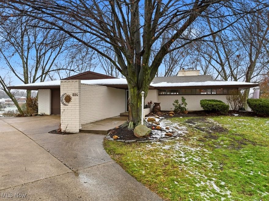 Don’t miss your chance to own this Mid Century Masterpiece!! This Frank Lloyd Wright inspired Contemporary is one of the most unique homes you will ever see. With all wood, masonry and glass construction this home offers a feeling that is unparalleled. When you arrive notice the quiet dead end cul-de-sac and the half acre lot that is perched nice and high offering panoramic views. Once inside the character of this home is immediately apparent. With its vaulted wood ceilings, glazed brick floor, beautiful fireplace and abundant windows the main living area will leave you in awe. The Kitchen is updated with stainless appliances granite counters and is open to a nice dining area with ample natural light and expansive views. Down the hall you will find two bedrooms and a full bath as well as the owners retreat with private bathroom. The character features and views continue through the bedrooms with two of them offering balcony access. The lower level offers a 4th bedroom a half bath and a large living space with lots of windows and access to a nice paver patio overlooking Tallmadge High school. This home truly brings the outside in with multiple outdoor living spaces found on both levels.  Furnace & air conditioner were recently replaced and LVT flooring has been added throughout. Call today for a full list of updates.  This home was a 1963 parade of Homes home and now It can be yours don’t miss out!!