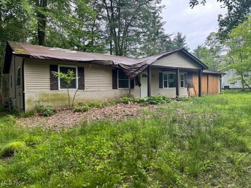 Welcome home to 9613 Kim Drive.  Nestled on a serene and heavily wooded 1.28-acre lot, this 3-bedroom, 1.5-bath ranch offers a peaceful retreat in the heart of Chesterland. Built in 1959 and offering 1,528 square feet of living space, the home features two spacious living rooms, a dedicated dining area, and a functional layout with plenty of potential.

A two-car attached garage provides convenience, and the scenic setting offers a beautiful backdrop for everyday living or future enhancements. While the home does need some updates and repairs, many possibilities await for those ready to make it their own.

Whether you're looking to renovate, invest, or create your dream home in a quiet wooded setting, this property is full of opportunity. Schedule your tour today and see the potential for yourself!
