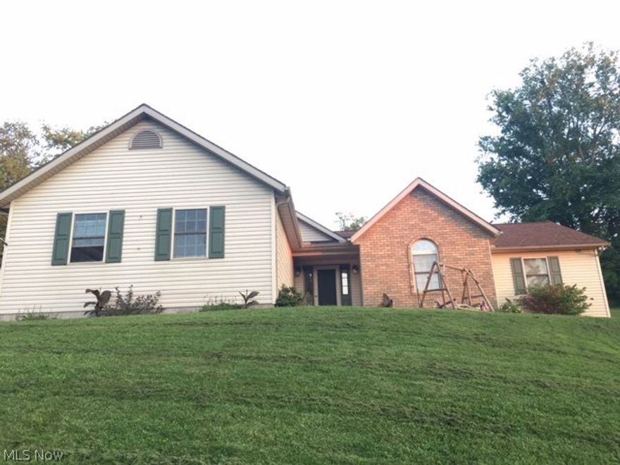 Welcome to a Country setting at 431 Scott Drive where you will find a well maintained spacious 3-4 Bedroom Vinyl + Brick Home.  Cozy living room with gas fireplace, cathedral ceilings and new Pergo flooring.  Hardwood floors in Kitchen and Dining Room.  Additional Living space in Partially finished basement with a half bath.  Large storage room next to finished area.  4th Bedroom located in lower level with a walk in closet.  Beautiful Landscaped yard with privacy for entertaining.  Make an appointment today!