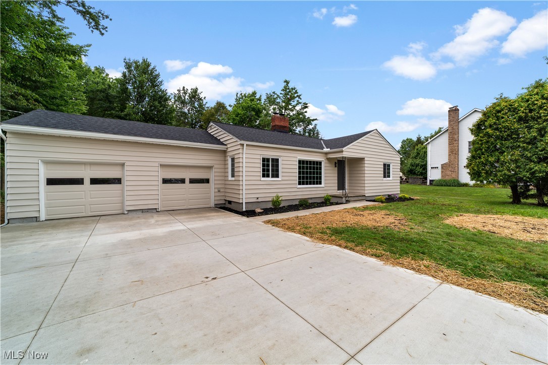 Welcome to 5844 Highland Rd – a beautifully renovated 4-bedroom, 2-bathroom ranch offering over 2,027 sq ft of stylish living space! Step inside to discover a thoughtfully updated interior featuring modern finishes throughout. The open-concept living and dining areas are enhanced by abundant natural light, elegant LVP flooring, and a charming yet contemporary fireplace. The updated kitchen is a true centerpiece, showcasing stainless steel appliances, a convenient breakfast bar for quick drinks, ample cabinet storage, and a dedicated pantry for extra convenience. All bedrooms feature plush carpeting for added comfort, with three spacious bedrooms sharing a beautifully updated full bathroom. The serene primary suite offers a private ensuite bath complete with a relaxing tub. Enjoy the ease of main-floor laundry and the practicality of a 2-car attached garage. Outside, the generous yard offers ample space for family fun, entertaining, or gardening projects. Perfectly situated in a desirable Highland Heights location, this home is close to top-rated schools, parks, and local amenities—offering both comfort and convenience in one. Completely renovated and move-in ready, this gem is the perfect place to call home.