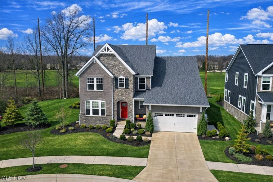 Nestled on an oversized cul-de-sac lot amongst verdant vistas, this immaculate Red Tail luxury home is brimming with extensive premium builder upgrades and aftermarket enhancements, a finished lower level, and absolutely unmatched backyard living! Your deluxe kitchen features upgraded cabs (dovetail, soft-close, pullouts), an oversized island + breakfast bar, premium appliances, pot filler, and generous walk-in pantry. In the great room, a modern floor-to-ceiling fireplace with blower offers refined ambiance complemented by vast views of manicured meadows. Bathed in amber western light, the dramatic two-story dining area enriches dinners with warmth and grandeur. Your ~500 sqft screened porch boasts enviable 3-season leisure, from quiet morning coffee to evening cocktails and family dinners. Denser west screens add sun/wind protection. Fenced dog relief area is equipped with a spigot for a hot tub. Two gorgeous paver patios with a grilling pergola offer space for sunning and BBQs amongst the scenic surroundings. Your spacious first-floor owner's suite features a spa-like ensuite with an elongated dual-sink vanity, tiled super shower + bench, jetted tub, WC, and a sizable walk-in closet. Enclosable office/flex room with adjacent half bath provides a quiet space to study/work from home. Private second floor guest quarters has two spacious bedrooms with WICs and a hall bath. The expansive lower level adds ~1,650 sqft of finished living space including a large living room, two flex rooms (gym, playroom, studio, second office), a full bath, plus unfinished storage. Fully equipped 2-car garage has a 4' extension for a golf cart/extended trucks, full insulation, a dog wash, and workstation/cabs. Whole-house generator and Ecowater Softener/Filtration System. Red Tail amenities--a 2-min bike/5-min walk via golf cart trails--include a championship 18-hole course, fitness center, restaurant, swimming/wading pools, and ball courts. A lifestyle of leisure and luxury awaits!