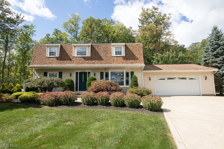 Spectacular 4-bedroom colonial in Munson Township and Chardon School District! Beautifully landscaped yard and stone paver walkway to the front door. Upon entering, you’re greeted with a meticulously maintained home with elegant hardwood flooring throughout the dining room and eat-in kitchen. The kitchen comes complete with a stainless-steel dishwasher, fridge, microwave, wall oven and island cooktop. Laundry rooms are located in the basement and 1st floor – both sets of washers and dryers transfer to the new owners!  The home features an owner’s suite with a private en-suite full bath with a gorgeous walk-in shower. 3 more bedrooms and another updated full bath complete the upstairs. The oversized 2 car garage provides ample space for both parking and storage. The backyard, with a deck and stamped concrete patio overlook a scenic and wooded rear lot that provides a serene and peaceful environment – a perfect place to enjoy your morning coffee and plenty of room for weekend entertainment. For peace of mind – the Generac home generator ensures that you will always have power during an outage. Well tank 2023, kitchen water purification system 2021, hot water tank 2021, Kinetico water system and softener 2020, 8 new windows 2023, dishwasher, microwave & wall oven 2021, Generac home generator and electrical panel 2019! Schedule you’re showing today!!