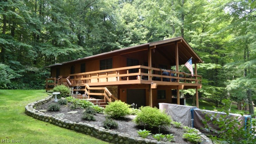 3 bedroom, 2.5 bath frame and cedar ranch.  Open floor plan with knotty pine tongue and groove cathedral ceilings.  Stone fireplace in the living room with french doors to the covered porch.  Island breakfast bar in the kitchen.  First floor laundry room.  First floor master suite includes glass doors to the deck.  Finished walk out lower level includes a rec room with wood burner.  1 car attached and 24 X 24 (2 car) detached garage.  New hot water heater in 2012.  Enjoy the beautiful 9.5+/- acre wooded country setting from the wrap around deck.  Stocked pond.  Seller is offering an America's Preferred Home Warranty.  Taxes reflect the seller receiving a homestead credit of $380.40 annually.  Current owner's electric averages $154 monthly.