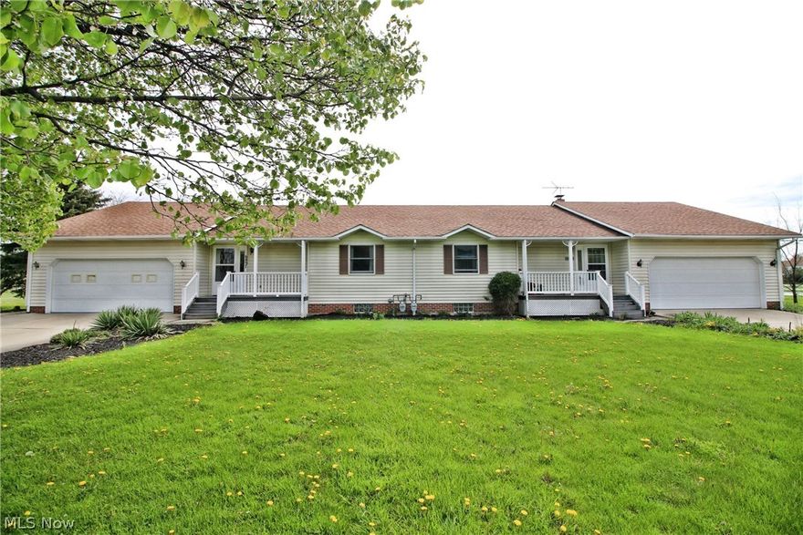 Custom built side by side Twinplex with over 2 acres in Sharon Township. Each side has enclosed porch, deck, full basement, 2 car garage and 2 oversized outbuildings.