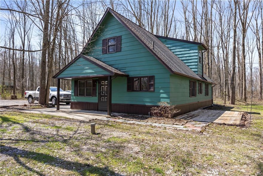 Set on 2.5 wooded acres along a peaceful stretch of Gifford Rd in Henrietta Township, this property offers a rare blend of privacy, seclusion, and rural charm just minutes from downtown Oberlin. Surrounded by natural beauty, the setting provides a quiet retreat while still allowing convenient access to local amenities and shopping.

The home features four bedrooms and two full baths, including two main floor bedrooms and a full bath with granite, along with the convenience of main floor laundry. A large eat-in kitchen provides a comfortable and functional gathering space, ideal for everyday living and entertaining. The upper level offers two additional bedrooms, an updated full bath, and a versatile bonus area perfect for a walk-in closet, reading or homework nook, computer or play space. Step onto the expansive elevated deck overlooking the wooded setting, with stairs leading to ground level perfect for outdoor enjoyment.

Recent updates include freshly painted interior, new carpet, and storm doors, adding immediate appeal. The property also includes two storage sheds and ample outdoor space ideal for relaxing, entertaining, or embracing country living.

Immediate possession offered. This is a unique opportunity to enjoy a secluded, wooded setting with functional living space and thoughtful updates in a highly desirable location.