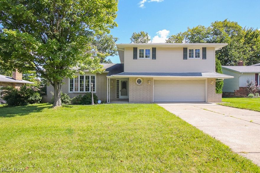 Stunning 4 bed 2.5 bath split level on a quarter acre! Bright and inviting home with warm grey walls and stylish white cabinets in kitchen and bathrooms. Two living areas, one includes a beautiful wood burning fireplace and leads out to back deck and yard. Four large bedrooms upstairs including spacious owner's suite with private bathroom. Gleaming hardwood flooring in all bedrooms. Basement has ample room for storage and large rec room.