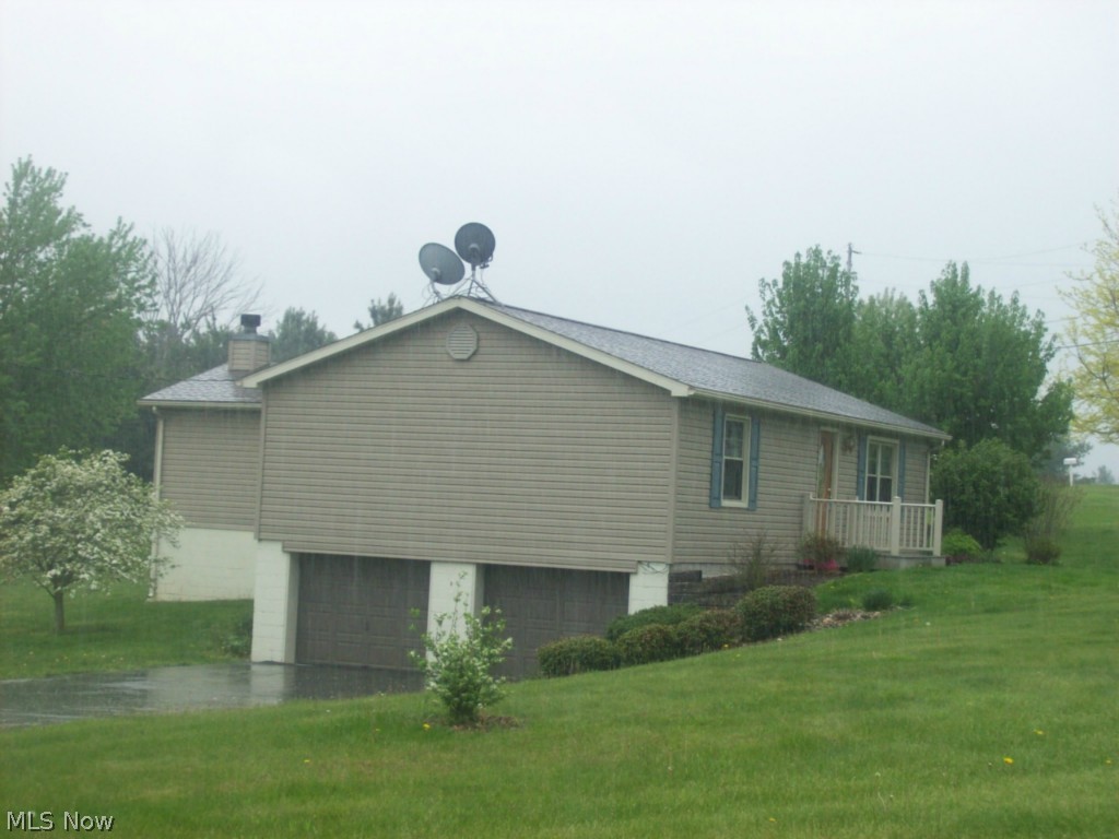Darling ranch home w/quiet country setting, huge master suite added approx. 7 years ago & many more updates: new siding, heat pump, roof, widows, marble bath, oak kitchen w/all appliances, Corian counter top w/molded bowls, laundry hookups upstairs & down, family room in basement with wood/burner/pellet stove, 2 car garage in basement w/long paved driveway, large corner lot w/lots of road frontage, fish pond w/landscaped patio.